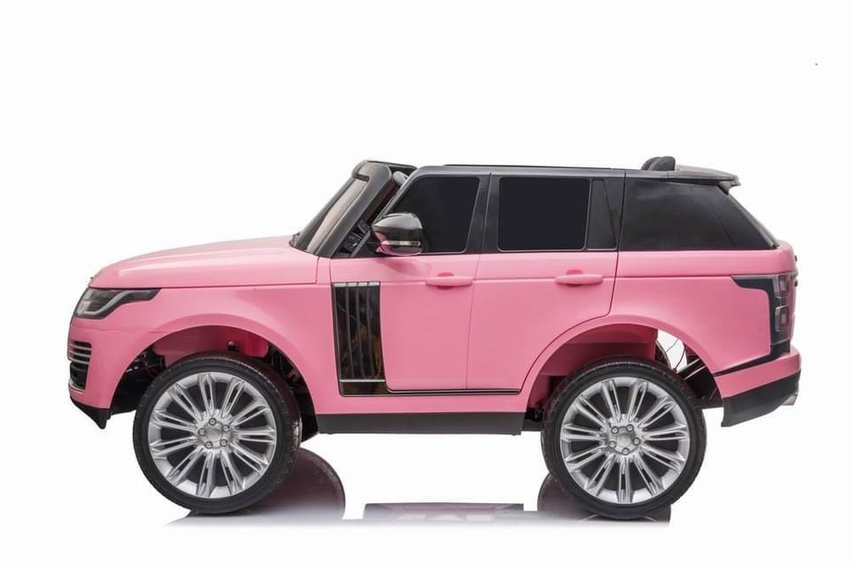 Electric pink Range Rover Vogue HSE 2 Seater Ride On Jeep with parental control on white backround.