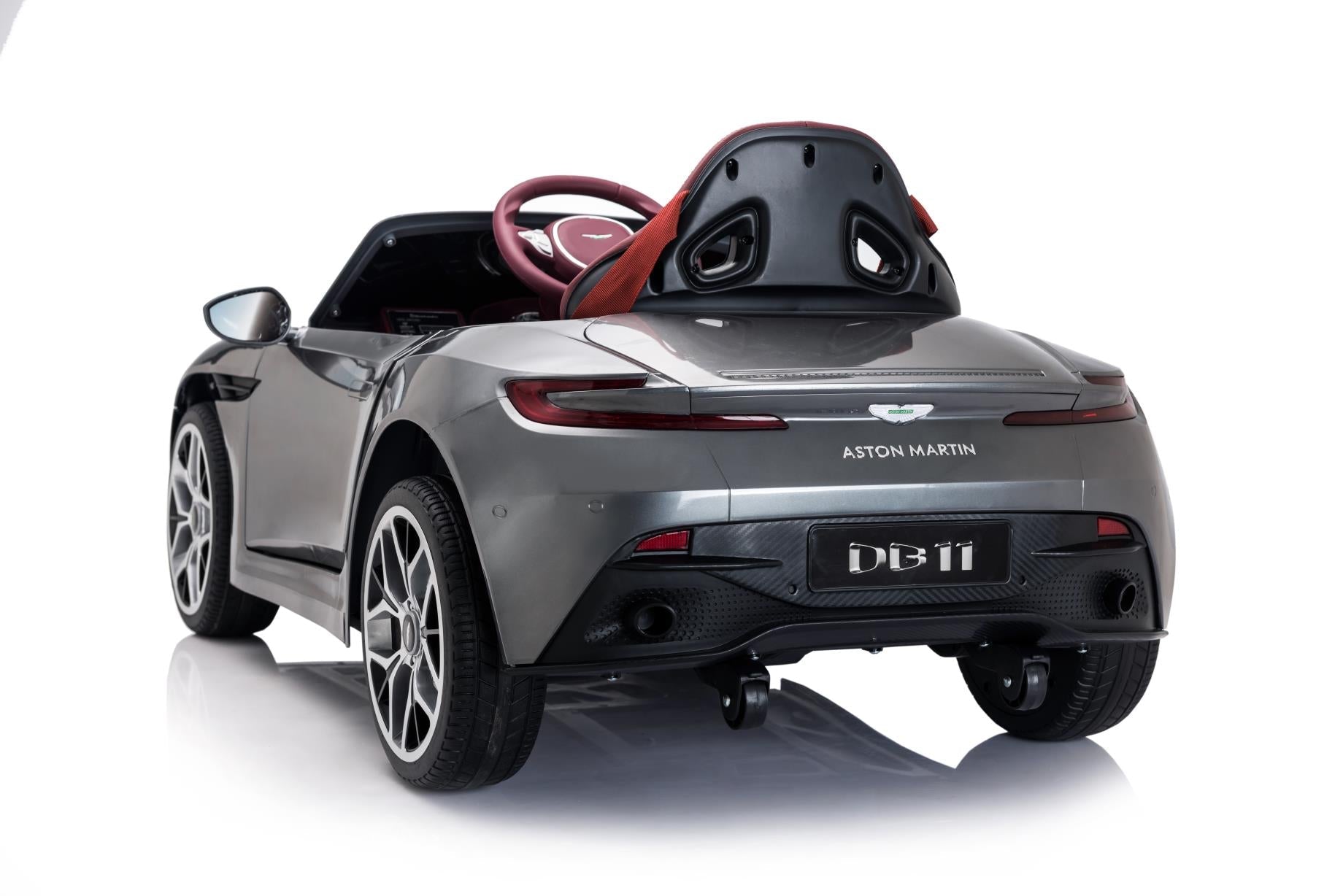 Other options could include:

1. "Child's grey Aston Martin DB11 electric ride-on car with remote control features."
2. "Small-sized grey Aston Martin DB11 electric ride-on car designed for children, depicted on a white background."
3. "Grey Aston Martin DB11 battery-powered ride-on toy vehicle for children with parental control feature."
4. "Children's Grey Aston Martin DB11 electronic ride car on white background."