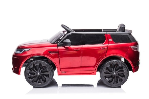 Metallic Red LAND ROVER Discovery 12-volt Electric Ride-on Car for Kids on a White Background.