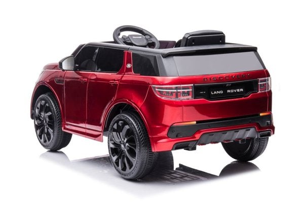 Metallic red Range Rover Discovery electric ride-on toy car for kids on a white background