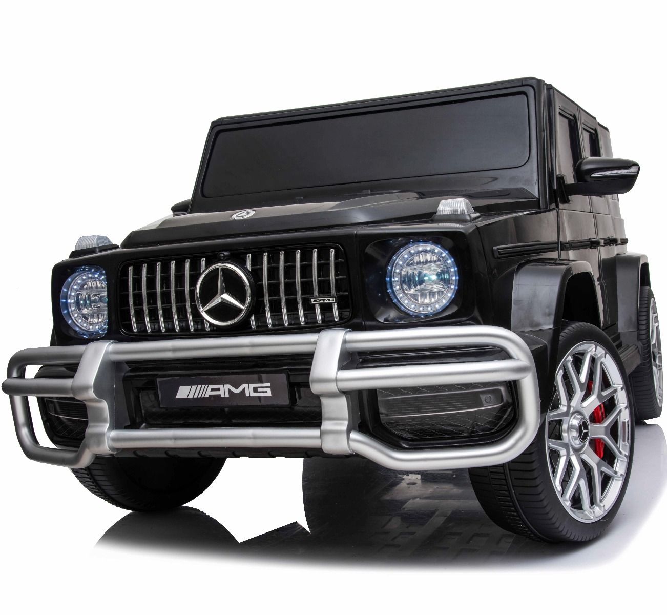 "Matte black Mercedes G-Wagon AMG G63 electric ride on 2-seater jeep with 4-wheel drive for kids on a white background"