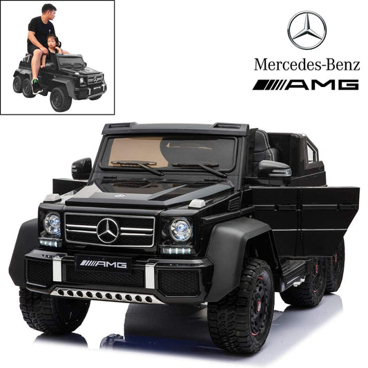 Child sitting on a black Mercedes G65 kids electric ride-on jeep with an adult supervising with remote control in background.