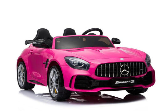 Pink Mercedes AMG GTR 2-seater electric car for kids with parental remote, on a white background from KidsCar.co.uk.