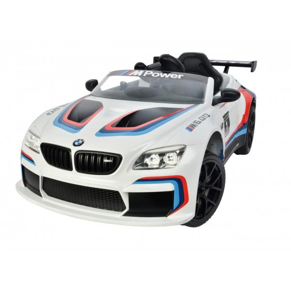 "White and blue BMW M6 GT3, 12 Volt electric ride-on race car offered by KidsCar.co.uk with remote control feature."