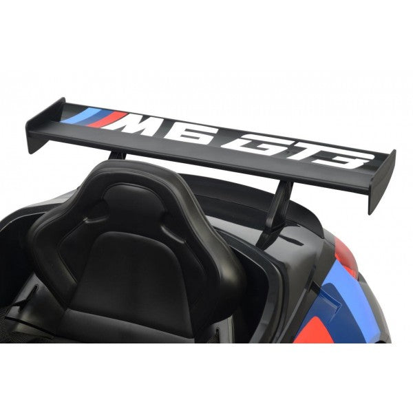 Black rear wing spoiler with 'm8 GTR' lettering on a black BMW M6 GT3, 12-volt electric ride-on car for kids.