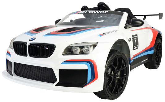 "Remote-controlled electric BMW M6 GT3 ride-on car in white and blue from KidsCar.co.uk."
