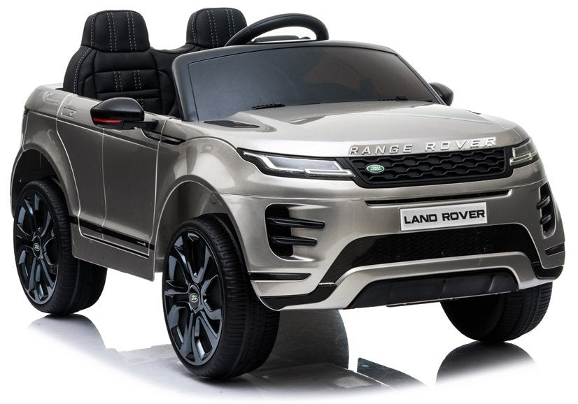 Revised Alt Text: A white, battery-powered Range Rover Evoque electric ride-on toy car with parental control feature, isolated on a white background.