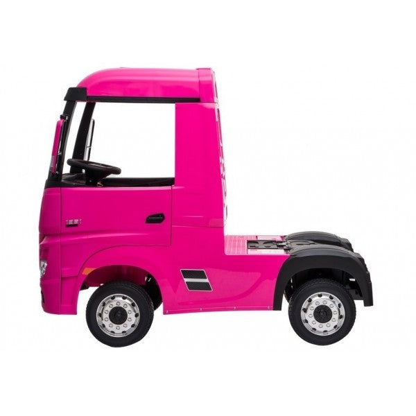 "Miniature pink Mercedes Actros electric ride on for kids with parental control, styled like a tiny Mercedes-Benz."
