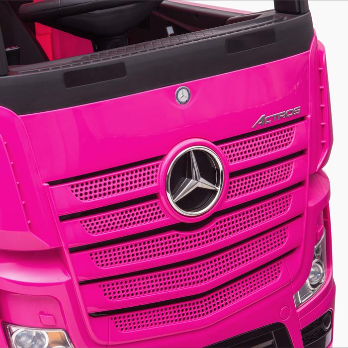 "Pink Mercedes Actros 24 Volt ride on lorry for kids with parental control and black hood"