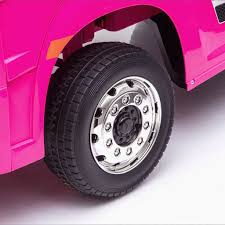 "Pink Mercedes Actros 24 Volt electric ride-on lorry for kids with parental control, displayed against a white background"