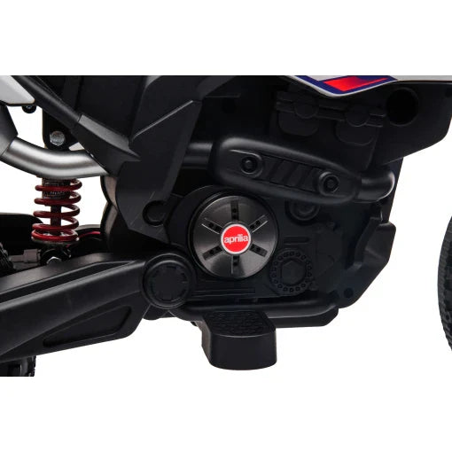 Aprilia 12V kids electric motorbike's S317 engine and rear suspension system close-up.