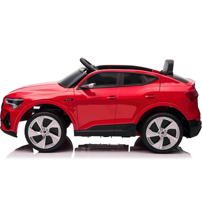 Red Audi e-tron Sportback electric ride on jeep for kids on white background