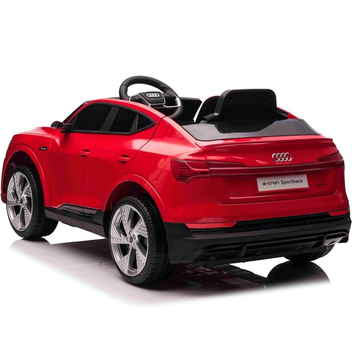 Captivating red Audi e-tron Sportback children's electric ride-on toy car, equipped with parental remote control.