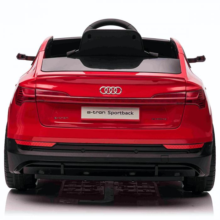 Red Audi e-tron Sportback toy car for kids, 12V electric power with parental remote control, from rear perspective.