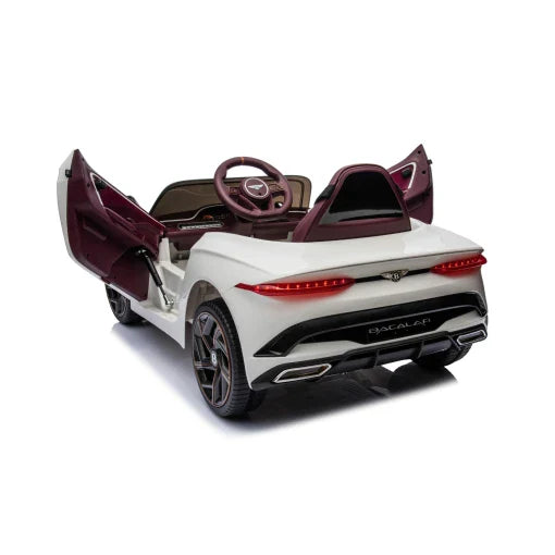 White Bentley Bacalar electric ride-on car for kids with open gull-wing doors and parent remote, 12 volt