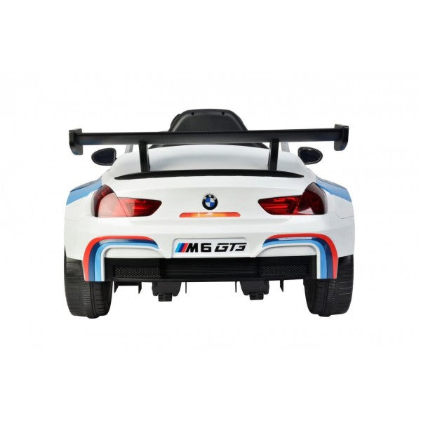 "Child's white electric BMW M6 GT3 12 Volt ride-on racing car from KidsCar.co.uk, displayed on a white backdrop."