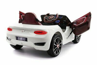 White Bentley GT EXP12 children's 12v electric ride-on car with open doors.
