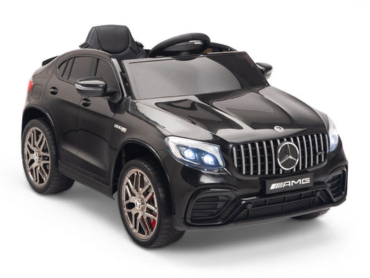 "Metallic Black Mercedes GLC 63S AMG electric ride on coupe for kids on white background."
