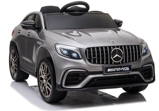 "Metallic Silver Mercedes GLC 63S AMG electric ride-on car for kids against a white backdrop"