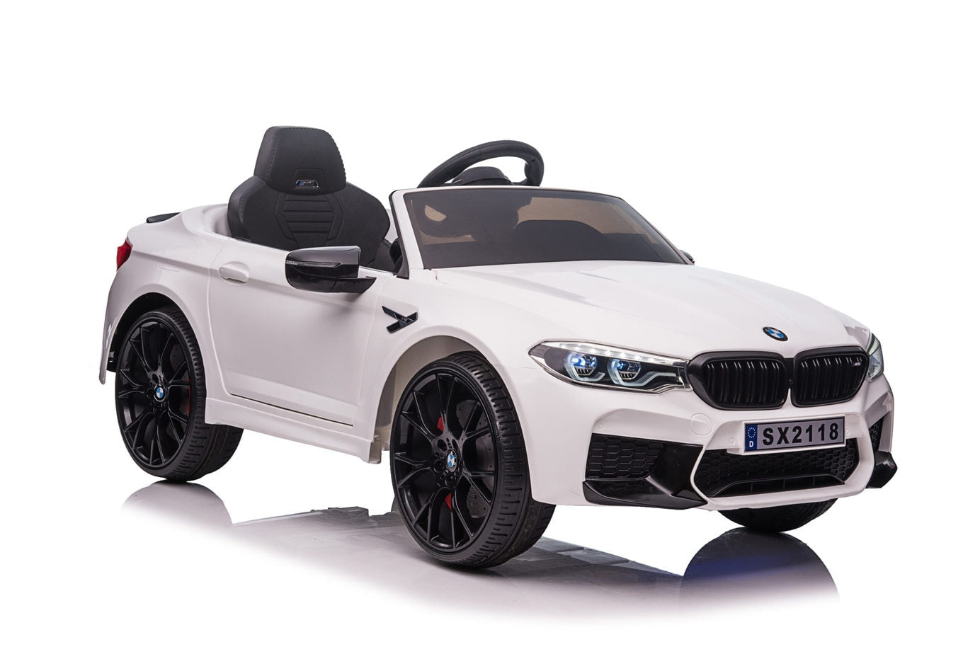 White BMW M5 Drift electric ride on car for kids, isolated on white background.