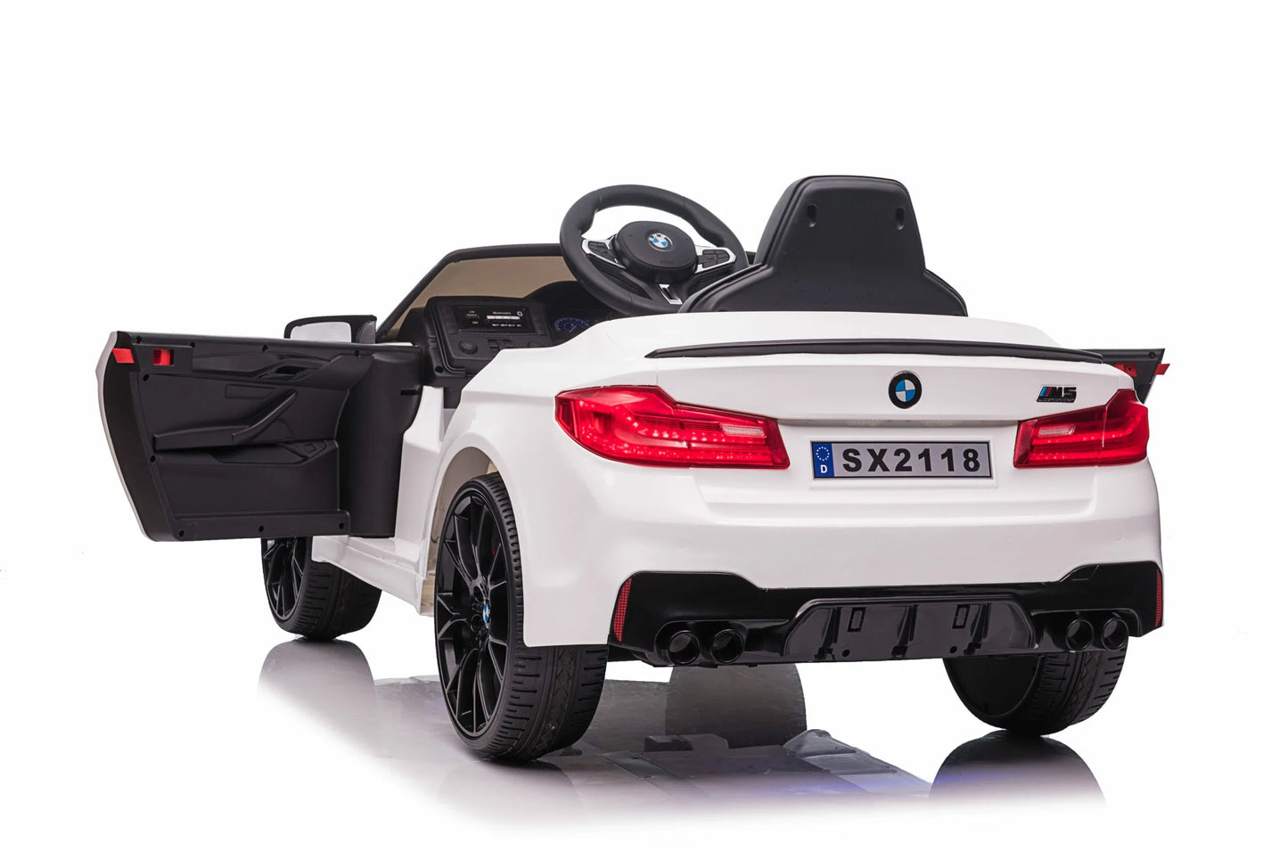 White BMW M5 Drift kids ride-on car, 24-volt electric vehicle with an open trunk, set against a white background.