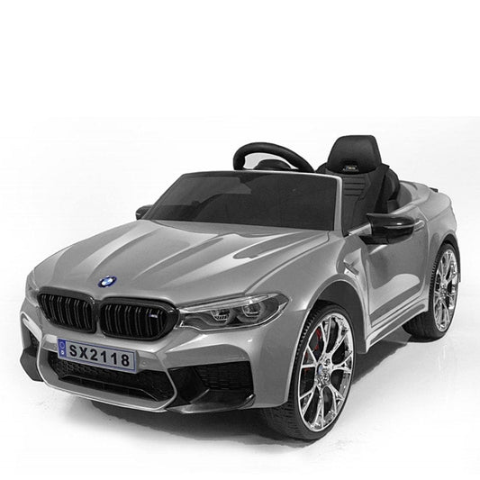 Silver BMW M5 electric ride-on car for kids on a white background
