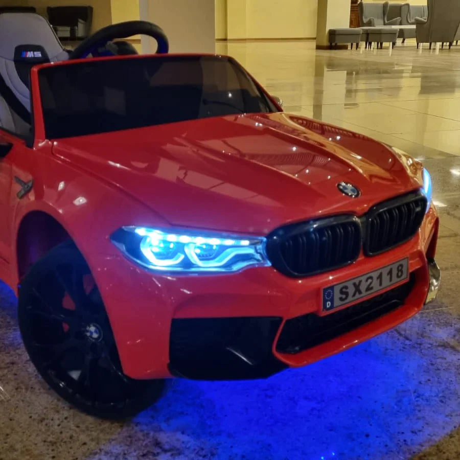 Red BMW M5 Drift ride-on replica car for kids with illuminated headlights, 24 volt electric power.
