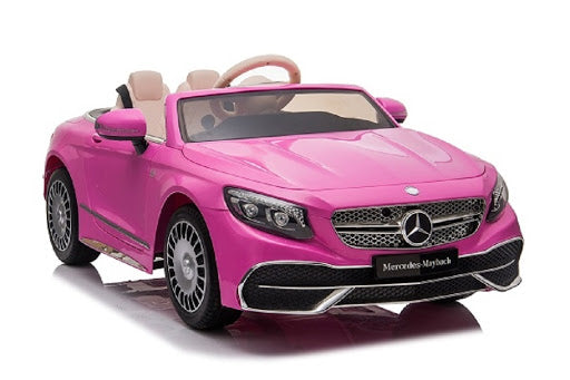 A pink electric Mercedes-Benz Maybach S650 ride on car for kids with a 12V battery, isolated on white background.