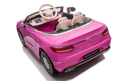 "A pink Mercedes-Benz S650 electric ride-on car for kids with parental control, isolated on a white background."