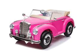 Vintage pink Mercedes-Benz 300S children's electric car with white wall tires on a spotless background