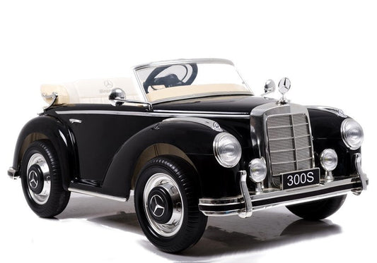 Classic black Mercedes Benz 300S children's electric ride on car on a white background