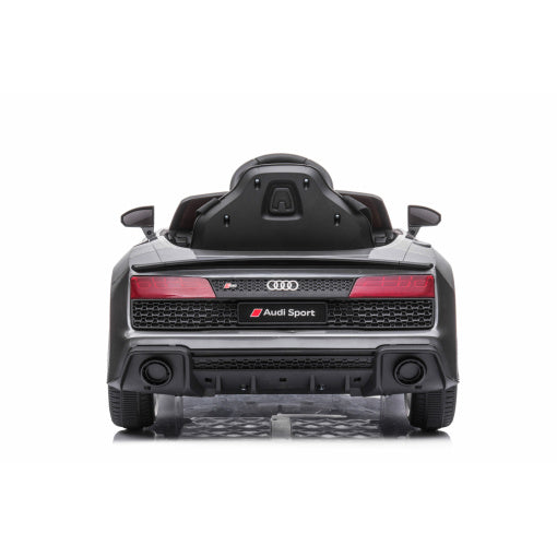 Rear view of luxe grey/silver Audi R8 licensed electric ride on car for kids against a white background.