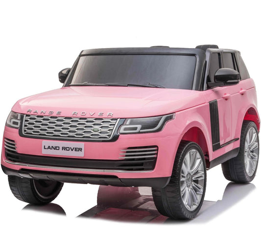 Pink toy replica of Range Rover Vogue SUV for kids against white background