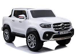 White Mercedes-Benz X Class 24v 4WD electric ride-on Jeep pickup truck for children on a white background.