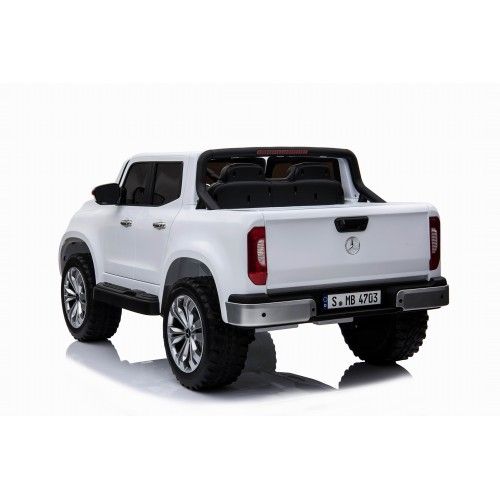White 24v 4WD Mercedes-Benz X Class Pickup battery powered electric ride on car jeep with open bed and European license plate for kids, isolated on a white background
