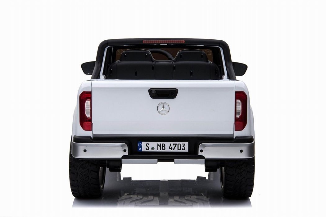 Rear view of a white Mercedes-Benz X Class Pickup 24v 4WD battery ride-on car jeep for kids on a white background.