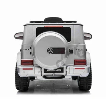 Rear view of a Mercedes-Benz AMG GLC63 S Coupe children's car, electric ride-on with spare wheel on tailgate.