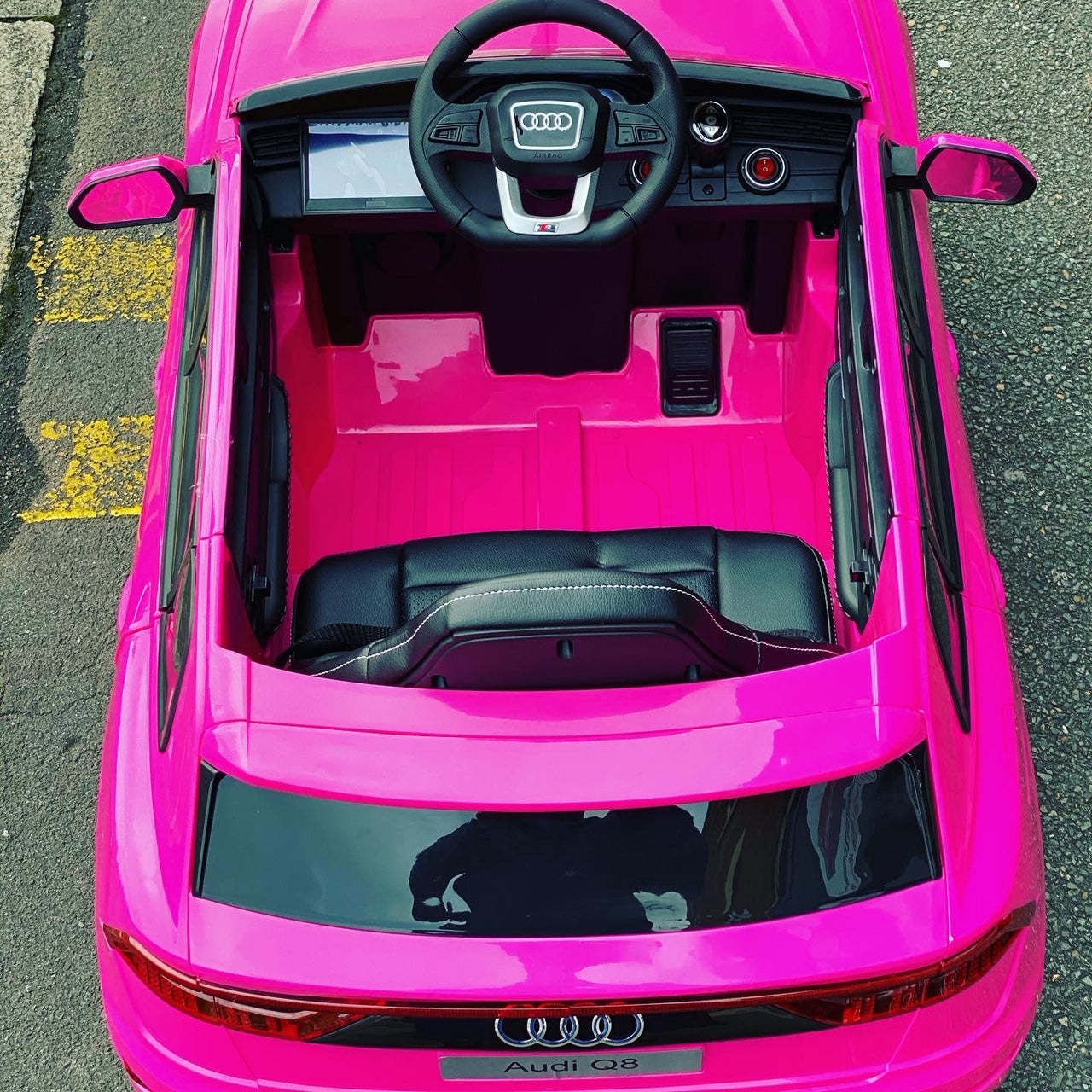 "Electric pink Audi Q8 SUV convertible 12 volt ride on toy car for kids"