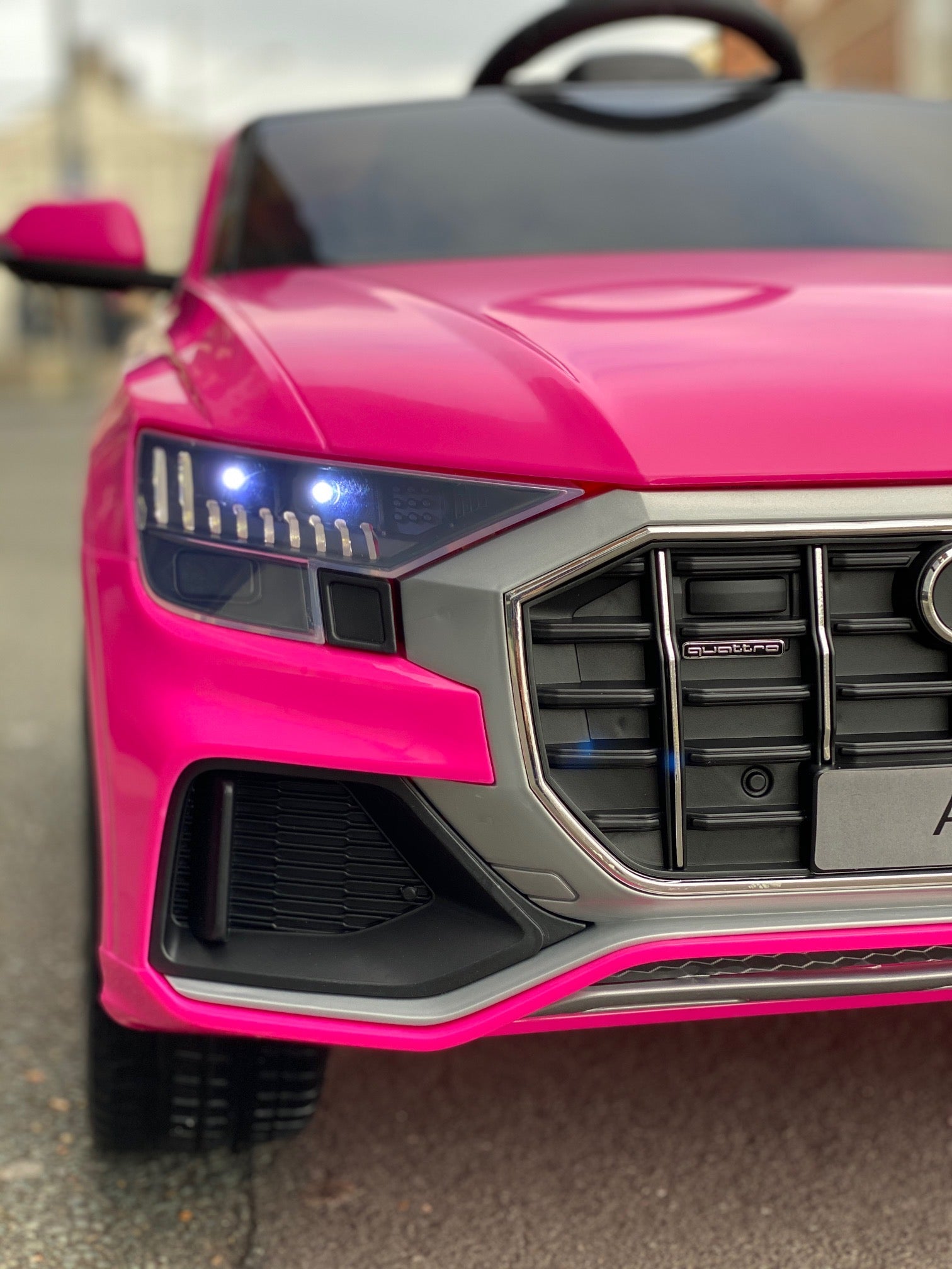 "12-Volt Pink Audi Q8 SUV Electric Ride-On with Parental Remote Control."