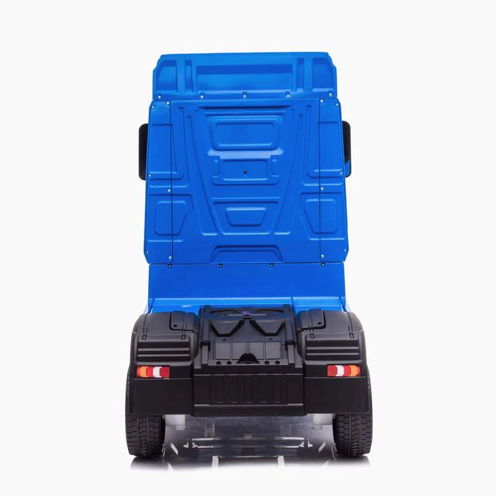 Rear view of a Blue Mercedes Actros kids ride on lorry with parental control, 24 volt, isolated on white background.