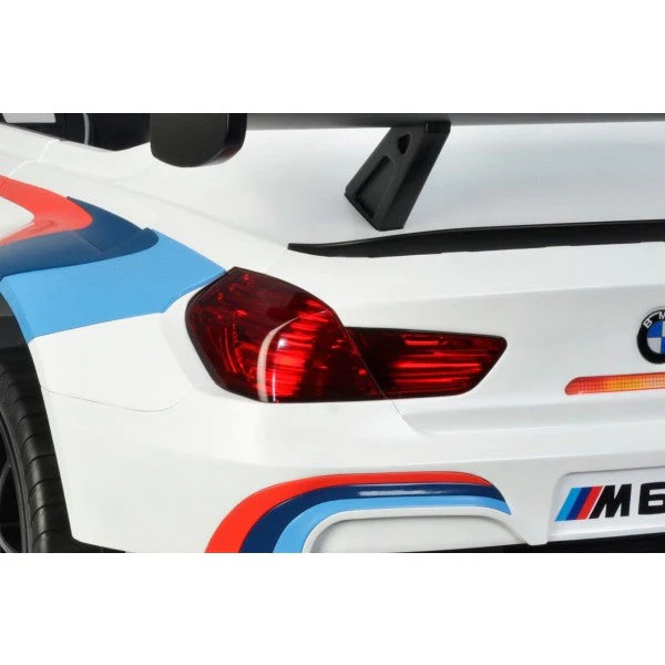 White BMW M6 GT3 12v electric ride-on car featuring blue and white stripes. Available at KidsCar.co.uk.