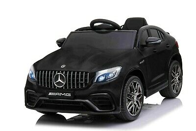 "Metallic Black Mercedes GLC 63S AMG kids car, coupe 12V, on a white background."