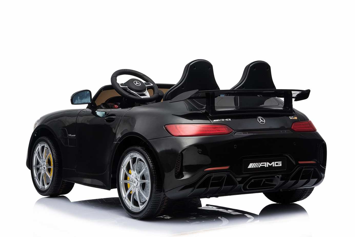 Black Mercedes AMG GTR 2-seater electric ride-on car with parent remote control, LED lights on a white background.