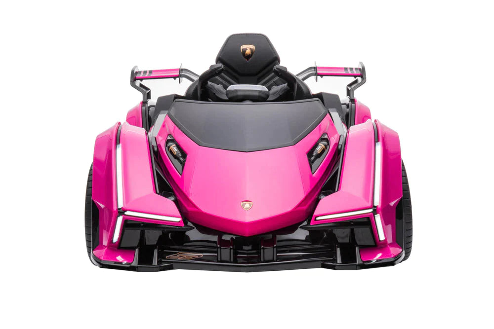 Front view of a 12V pink Lamborghini Gran Turismo kids electric ride on car featuring futuristic design, isolated on white background.