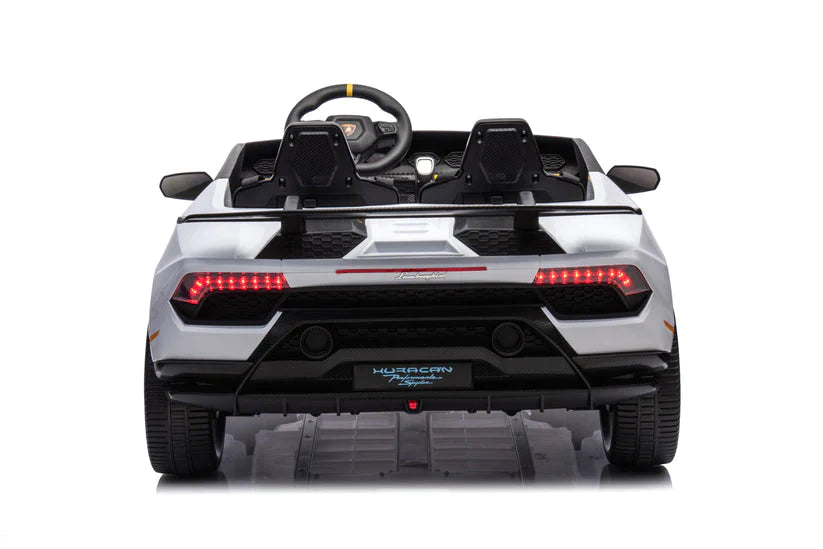 Rear view of white Lamborghini Huracan kids car, 24 Volt model with steering wheel and seats on a white background.