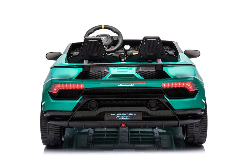 Rear view of illuminated LED taillights on green Lamborghini Huracan electric ride-on for kids, featuring parental remote control.