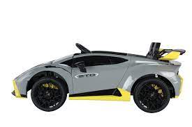 Grey Lamborghini Huracan STO 12V Kids Car with Yellow Accents, Open Scissor Doors and Electric Ride-On Feature