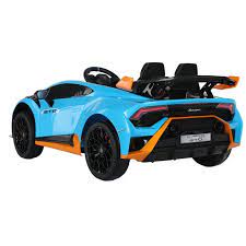 Blue Lamborghini Huracan STO 12V Drift electric ride on toy car with orange trim for kids