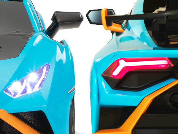 Two modern Lamborghini Huracan STO 12V Drift ride-on cars for kids in vibrant blue, displaying glowing headlights and taillights.