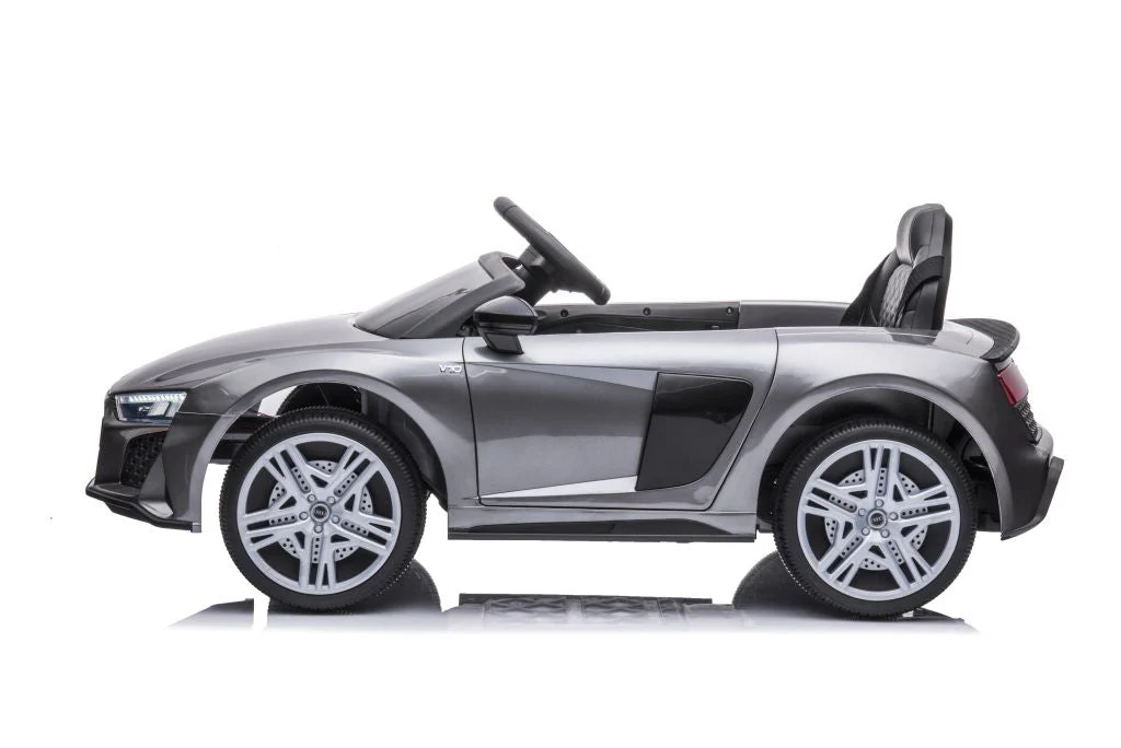 Grey/Silver Audi R8 licensed electric ride-on car A300 for kids, modeled after luxury convertible vehicle on white background.